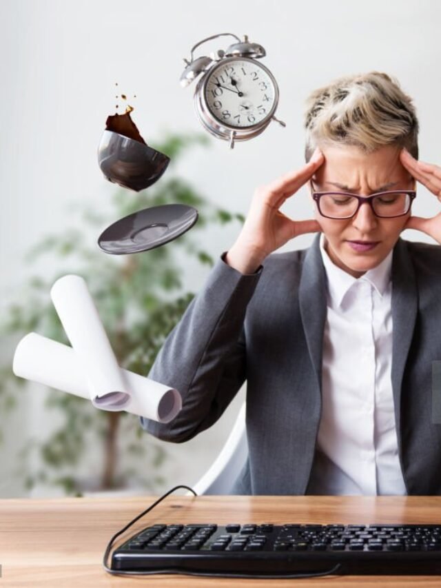 Businesswoman working on a laptop, overworking, under pressure